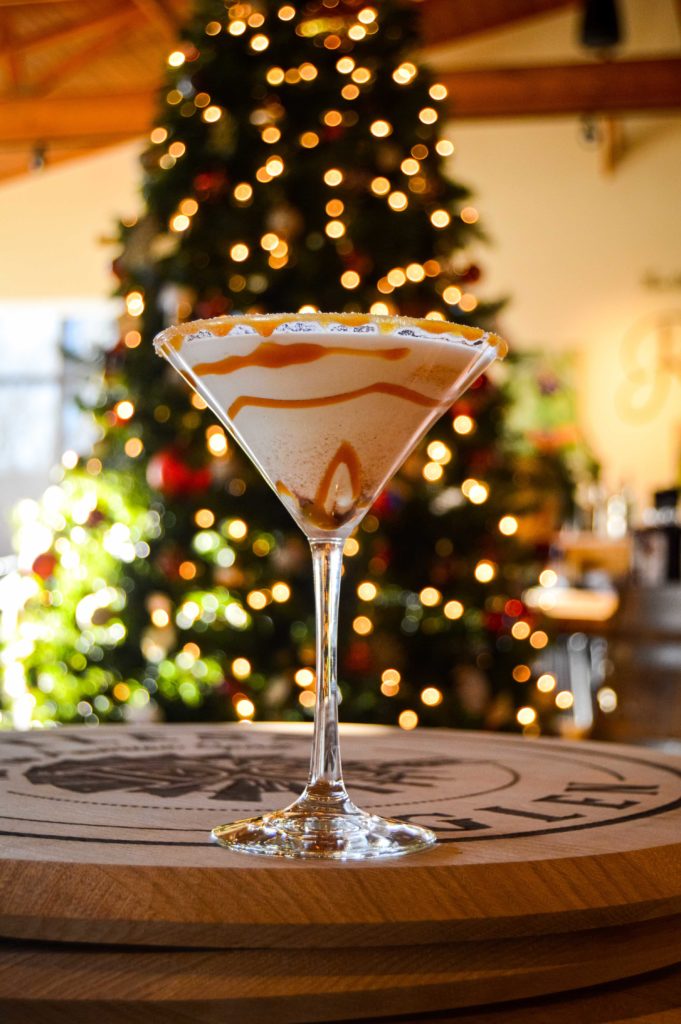 snickerdoodle martini in front of the christmas tree